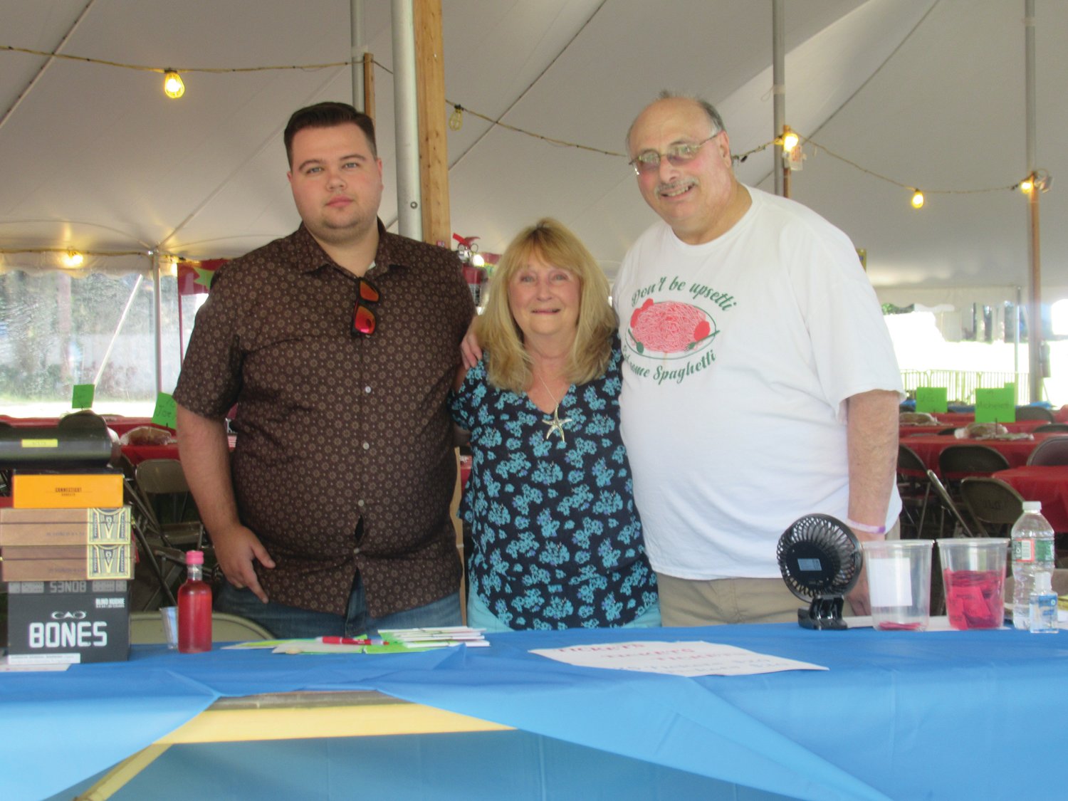 GRAND GREETERS: Darrien Martin, Linda Bessette and Joe Andreozzi welcomed nearly 170 people to OLG’s Steak and Cigar Night Saturday in Johnston.
